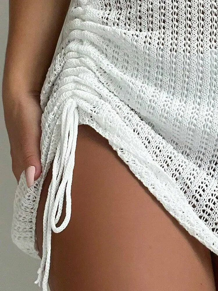 Ażurowa spódniczka plażowa mini z wiązaniem i asymetrycznym krojem - Senséra